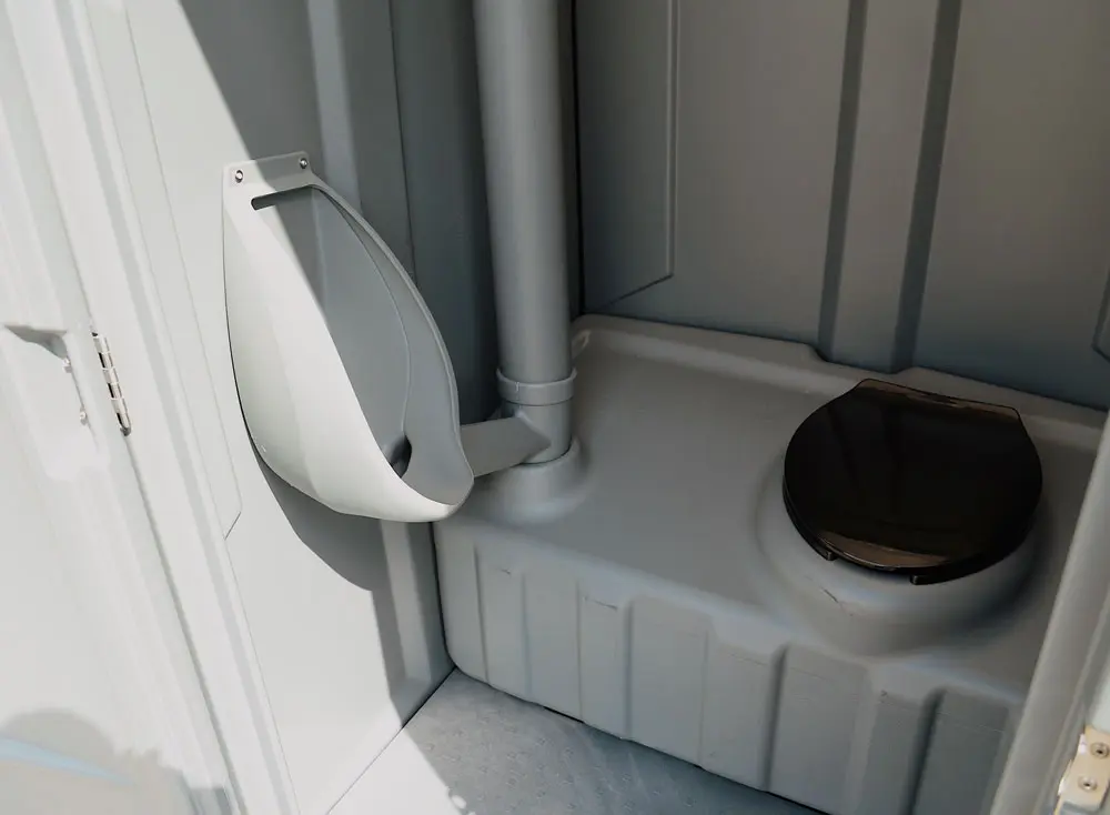 Inside view of one of the standard Porta potties at Basin Septic & Rentals