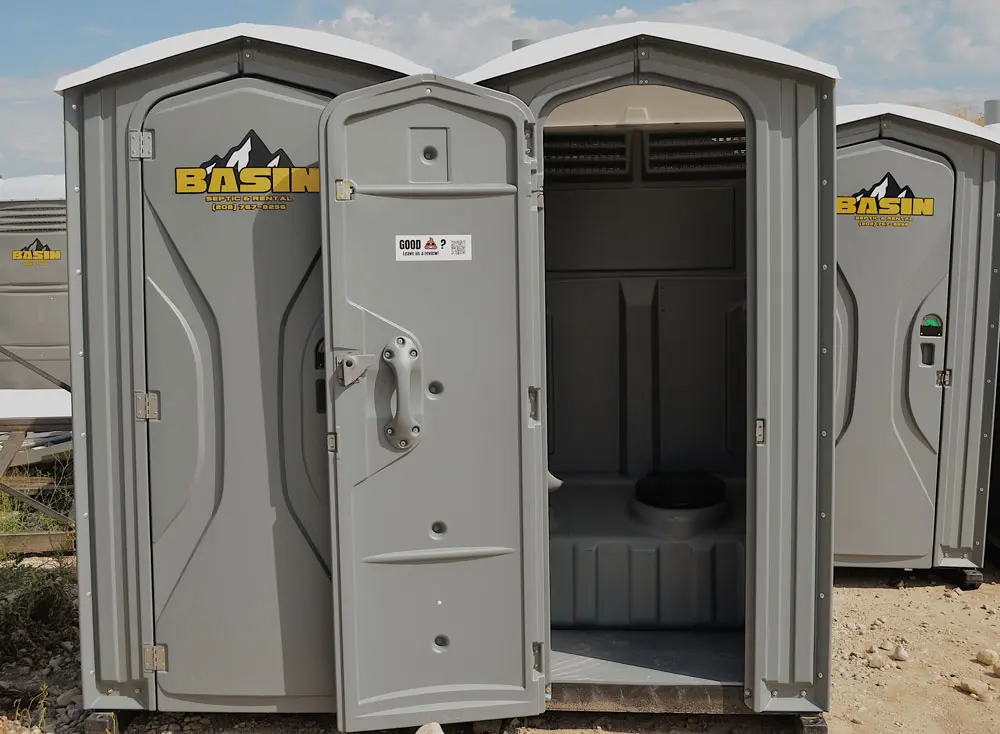 Stardard Porta Potty from Basin Septic & Rental with its door open