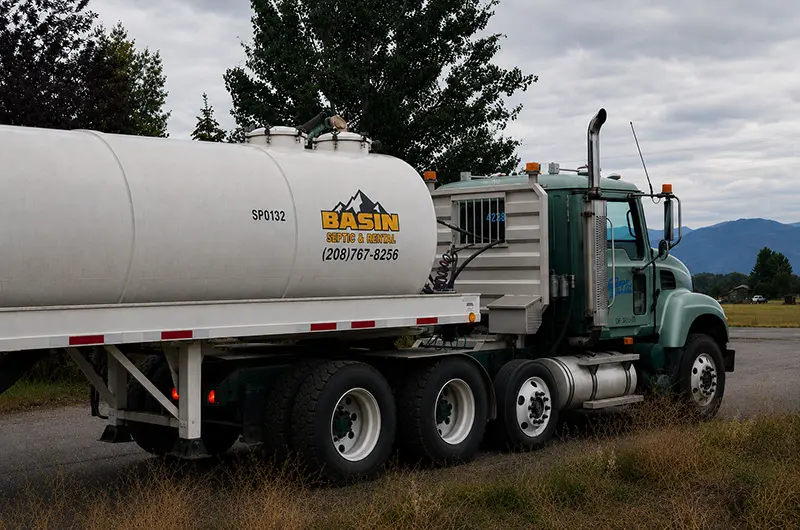 Large storage tank on a semi from Basin Septic & Rentals