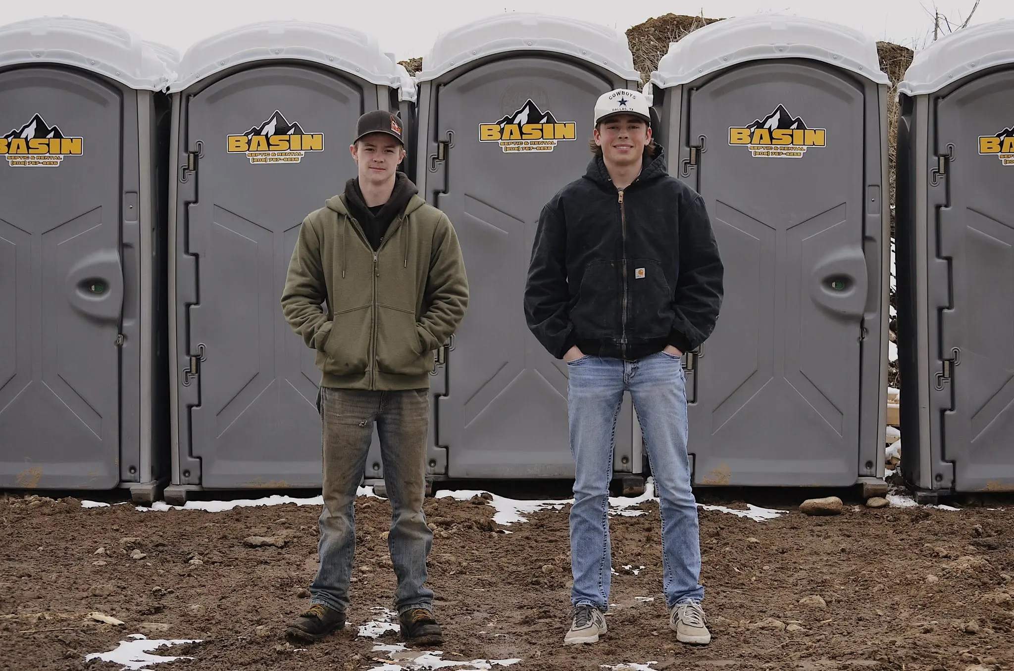 Man empty a tank from a portable bathroom from Basin Septic and Rentals